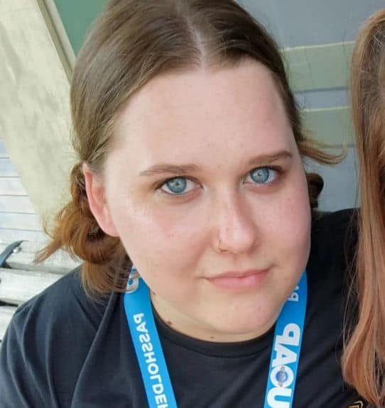 Two women with blue eyes posing for a photo.