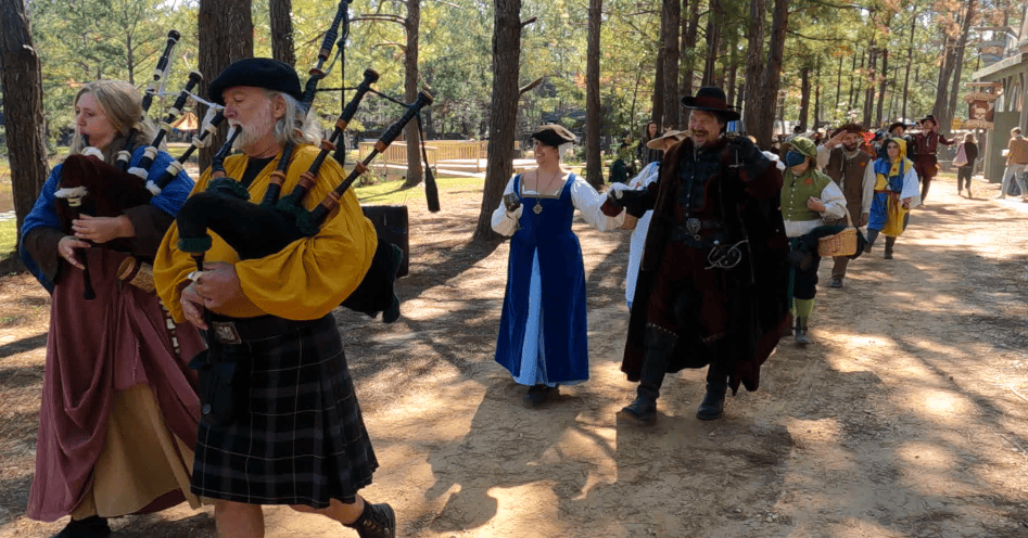 Parade of the King, Queen, and their court in the Village of Albright.