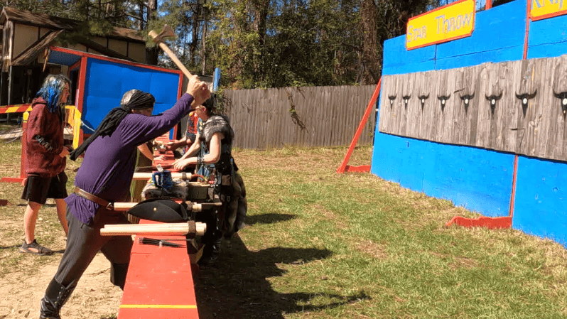 Kelly throwing an axe.