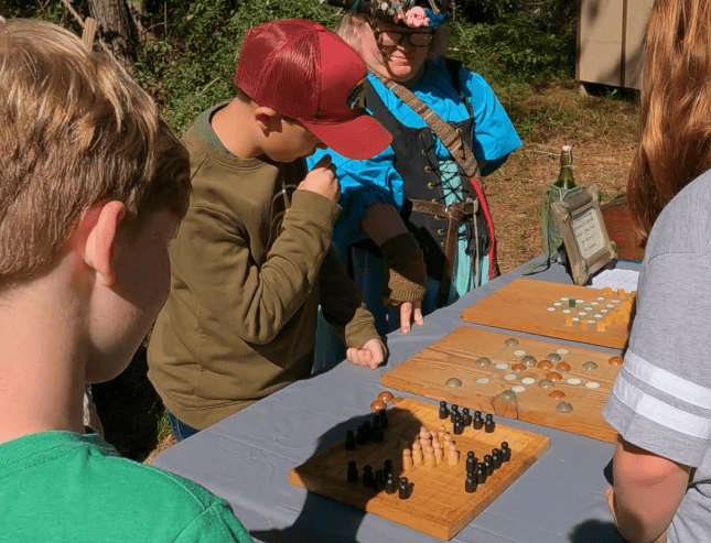 Kids playing wooden board games