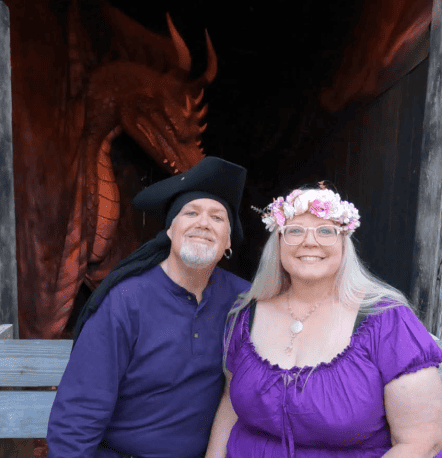 Kelly and Nancy enjoying a picture in front of a dragon at the RenFest.