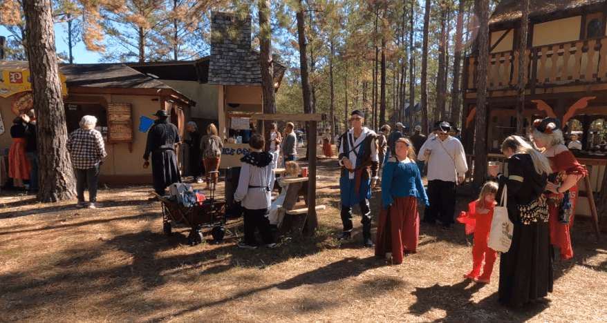 Villagers and guests in the food area.