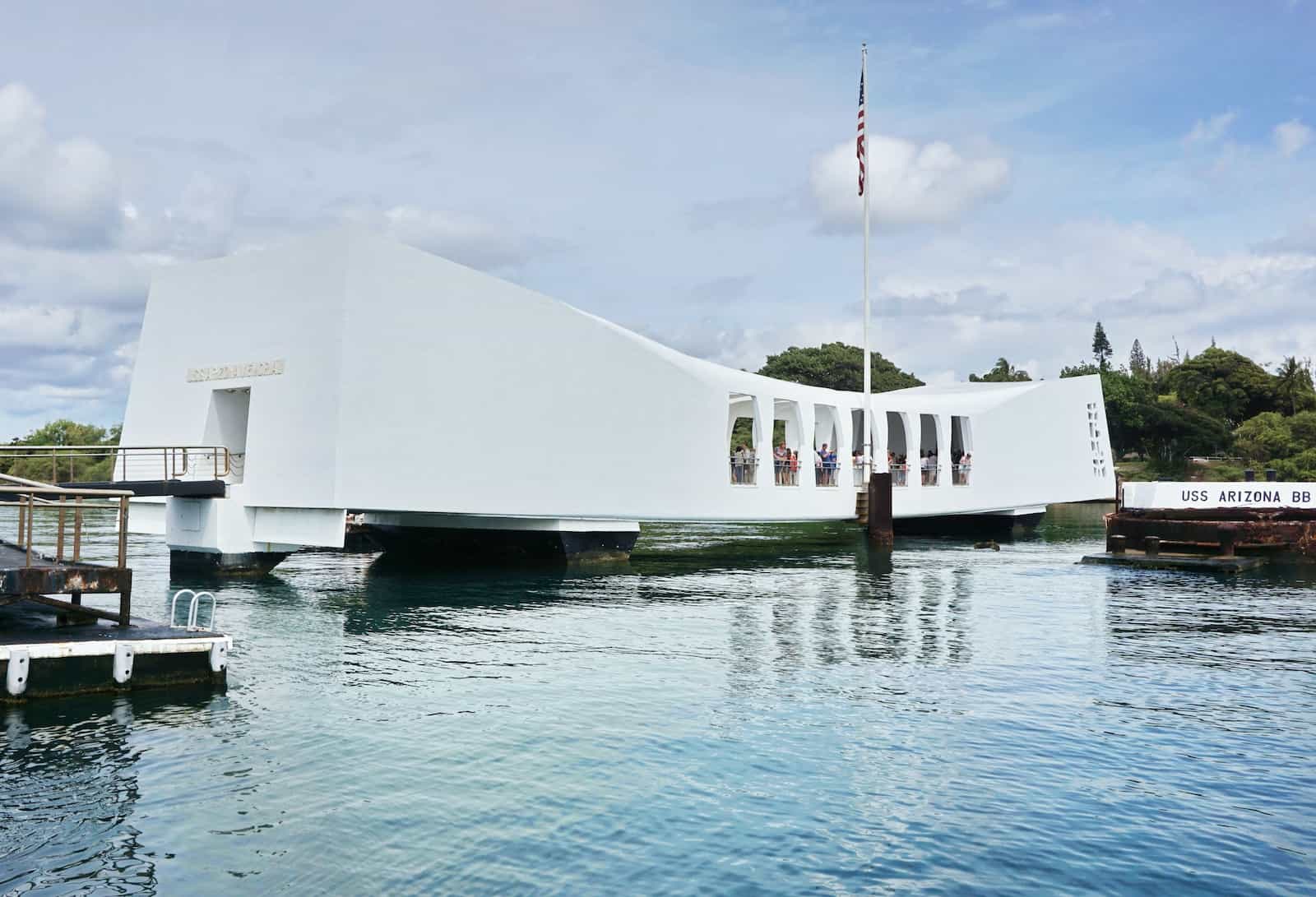 a large white building sitting on top of a body of water